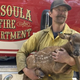 Cinder with firefighter Nate Sink.